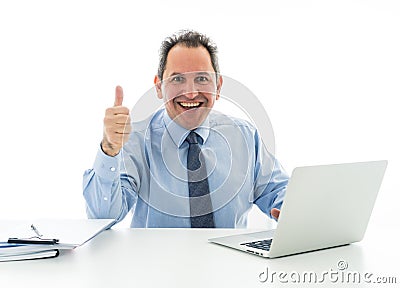 Mature caucasian businessman working on laptop computer at office in happy working and satisfaction Stock Photo