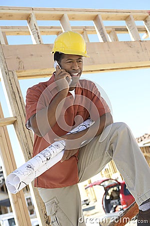 Mature Contractor On Call Stock Photo