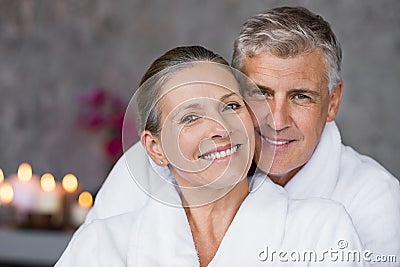 Mature couple in bathrobe at spa Stock Photo