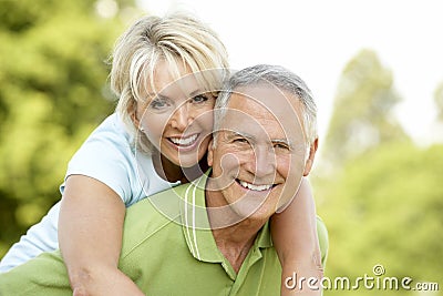 Mature couple having fun in countryside Stock Photo