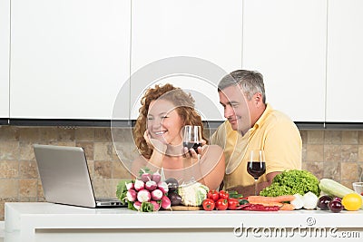 Mature couple in the kitchen Stock Photo