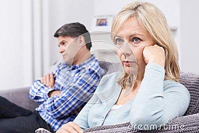 Mature Couple With Relationship Difficulties Sitting On Sofa Stock Photo