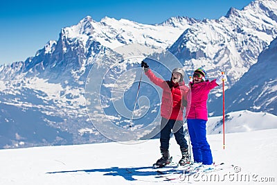 Mature couple skiing in the mountains Stock Photo