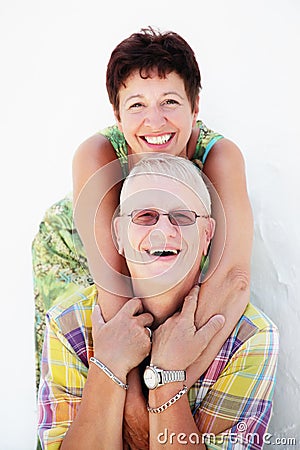 Mature couple smiling and embracing Stock Photo