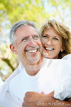 Mature couple smiling and embracing Stock Photo