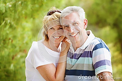 Mature couple smiling and embracing Stock Photo