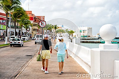 Mature couple walking on promenade Editorial Stock Photo