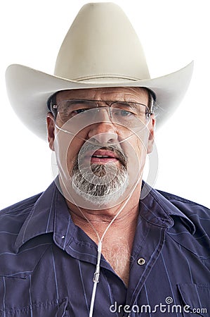Mature cowboy with breathing disability Stock Photo