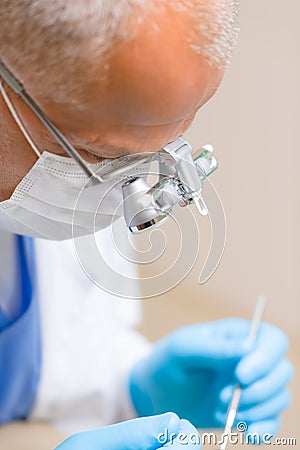 Mature dentist surgeon at office Stock Photo