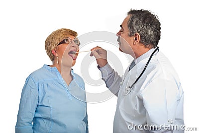 Mature doctor examine sore throat Stock Photo