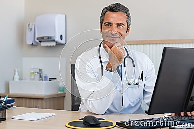 Mature doctor at office Stock Photo