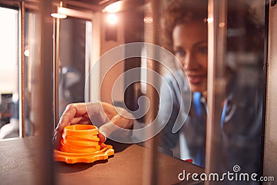 Mature Female College Student Studying Engineering Using 3D Printing Machine Stock Photo