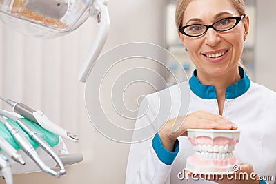 Professional dentist working at his dental clinic Stock Photo