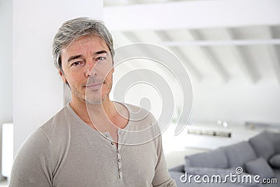 Mature handsome man at home Stock Photo