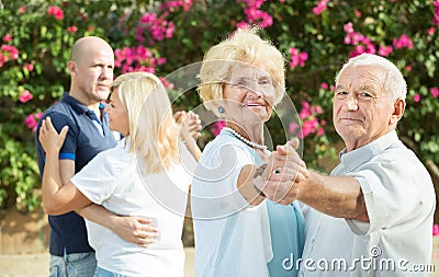 Mature friends dancing walts Stock Photo