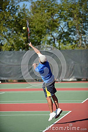 Mature Hispanic tennis player Stock Photo