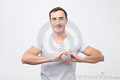 Mature italian man making out of hands heart. Doing charity work Stock Photo