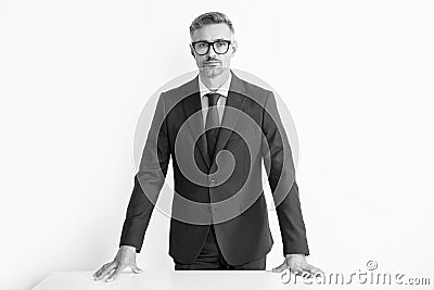 mature leader in suit at the table wear glasses Stock Photo