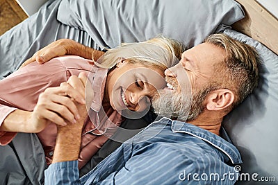 A mature loving couple in cozy Stock Photo