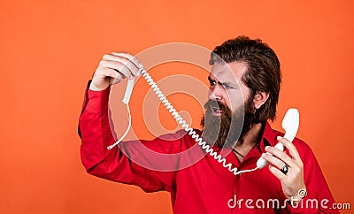 mature male hold broken retro phone. guy with beard and moustache answering the call. telephone conversation. bearded Stock Photo