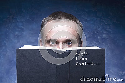 Mature man being focused and hooked by book. Santa I can explain... Stock Photo