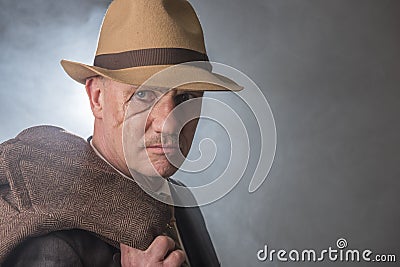 Mature man dressed as a 1940s gangster Stock Photo