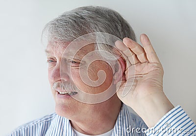 Mature man has trouble hearing Stock Photo