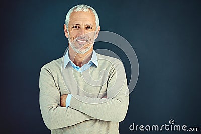 Mature, man and portrait of happy professor in studio, blue background and education mockup. Smile, teacher and Stock Photo