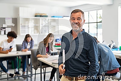 Mature man professor standing in class Stock Photo