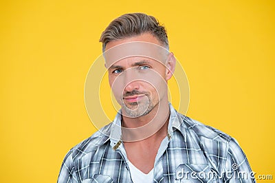 mature man smile with grizzle hair on yellow background Stock Photo