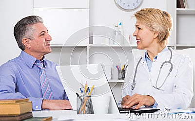 Mature man visits doctor Stock Photo