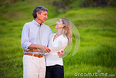 Mature middle age couple in love hugging Stock Photo