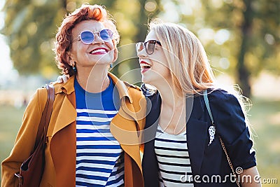 Mature mother and adult daughter enjoying a day in the park Stock Photo