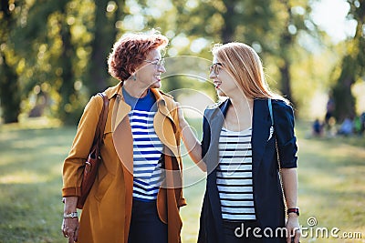 Mature mother and adult daughter enjoying a day in the park Stock Photo