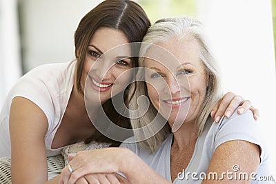 Mature Mother And Daughter Hugging Stock Photo