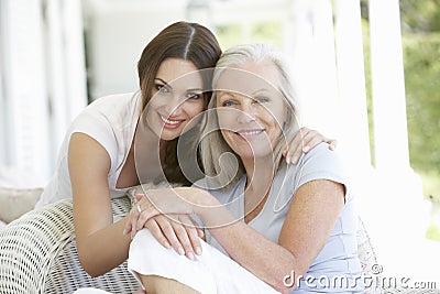 Mature Mother And Daughter Hugging Stock Photo