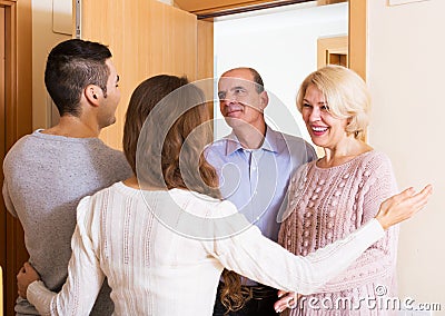 Mature people coming to visit adult kids Stock Photo