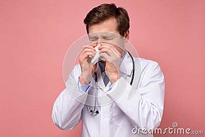 Mature sick doctor sneezing,being ill with flu Stock Photo