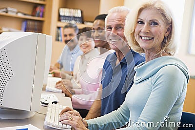 Mature students learning computer skills Stock Photo