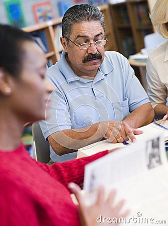 Mature students studying in library Stock Photo