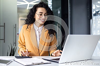 Mature successful financier accountant on paper work with papers, documents contracts and charts graphs, businesswoman Stock Photo