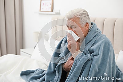Mature suffering from cold. Dangerous virus Stock Photo