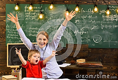 Mature tutor teacher giving private lessons to preschool boy, Back to school, Teachers are as different as the students Stock Photo