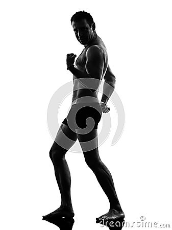 Mature underwear man flexing muscles silhouette Stock Photo