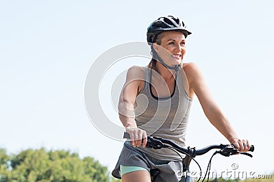 Mature woman cycling Stock Photo