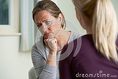 Mature Woman Discussing Problems With Counselor Stock Photo