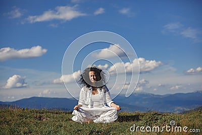 Adult yoga woman on the nature Stock Photo