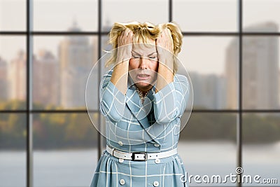 Mature woman in full desperation. Stock Photo