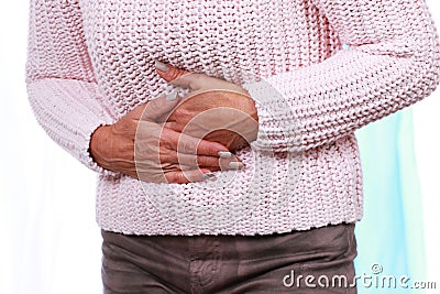 Mature woman with her hands on her tummy Stock Photo