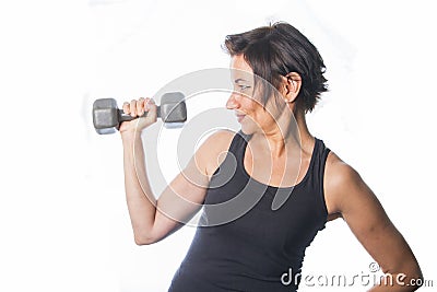 Mature woman lifting weights Stock Photo